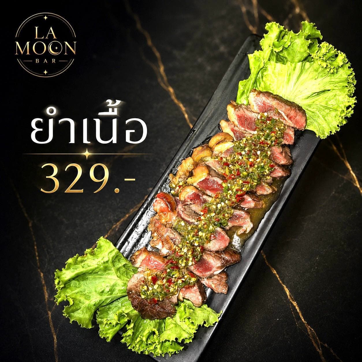 La Moon menu card for Thai spicy beef salad, sliced beef with herbs along a long black plate